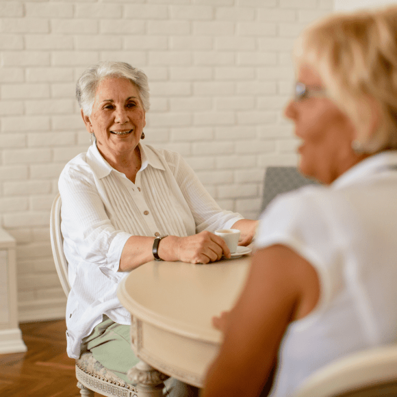 2 women drinking tea and chatting